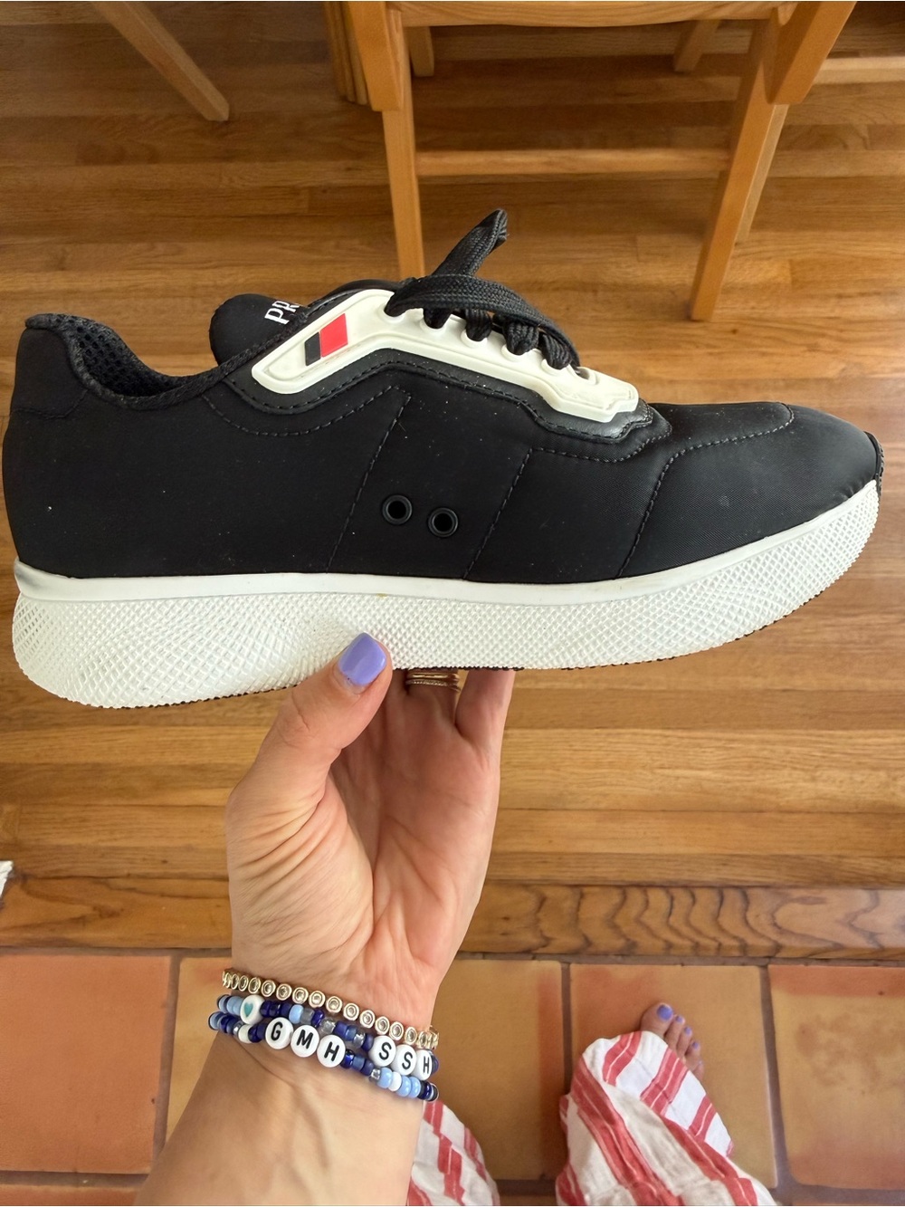 Prada Black and White Athletic Sneakers with Red Accent